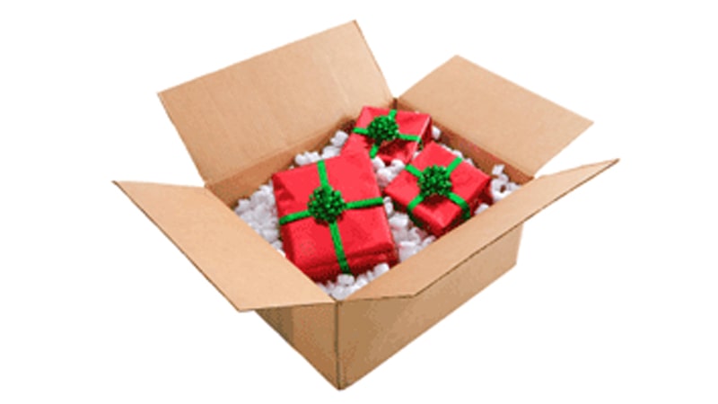 A shipping box full of wrapped presents.