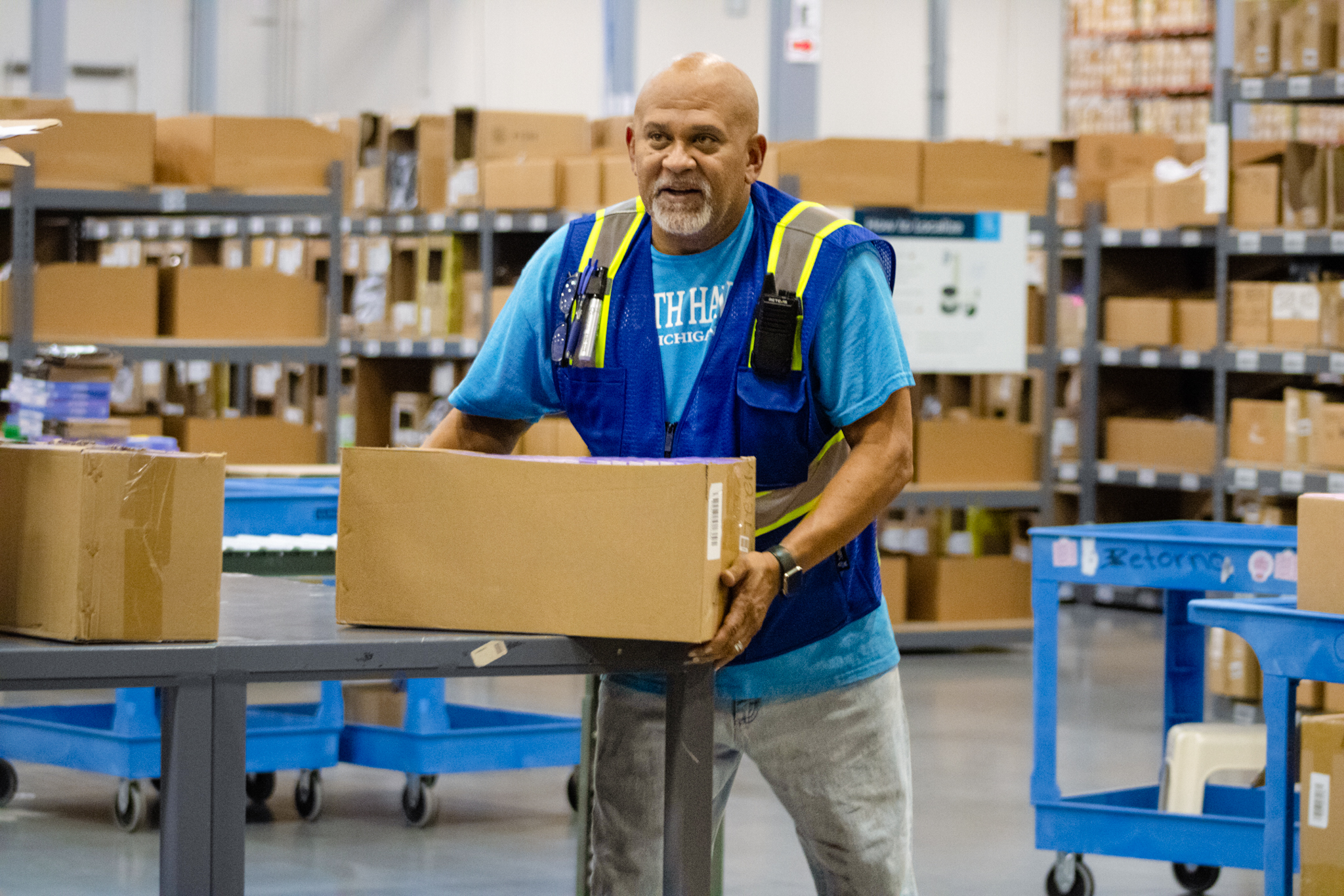 worker moving packages in a fulfillment center