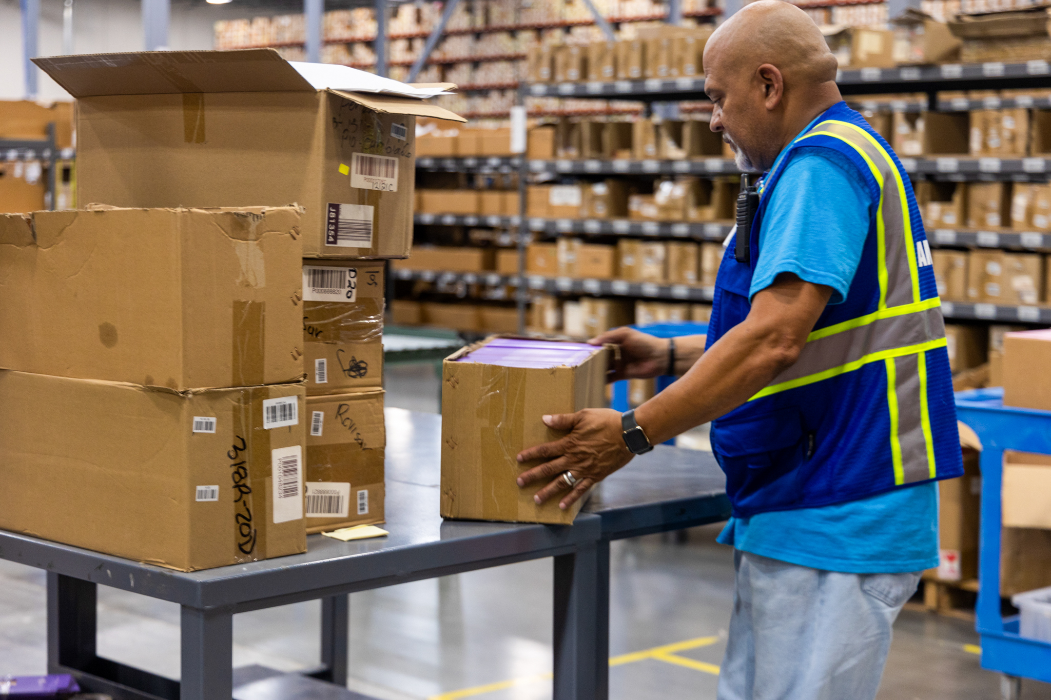 worker checking order accuracy in fulfillment center