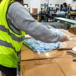 worker picking items at a fulfillment center