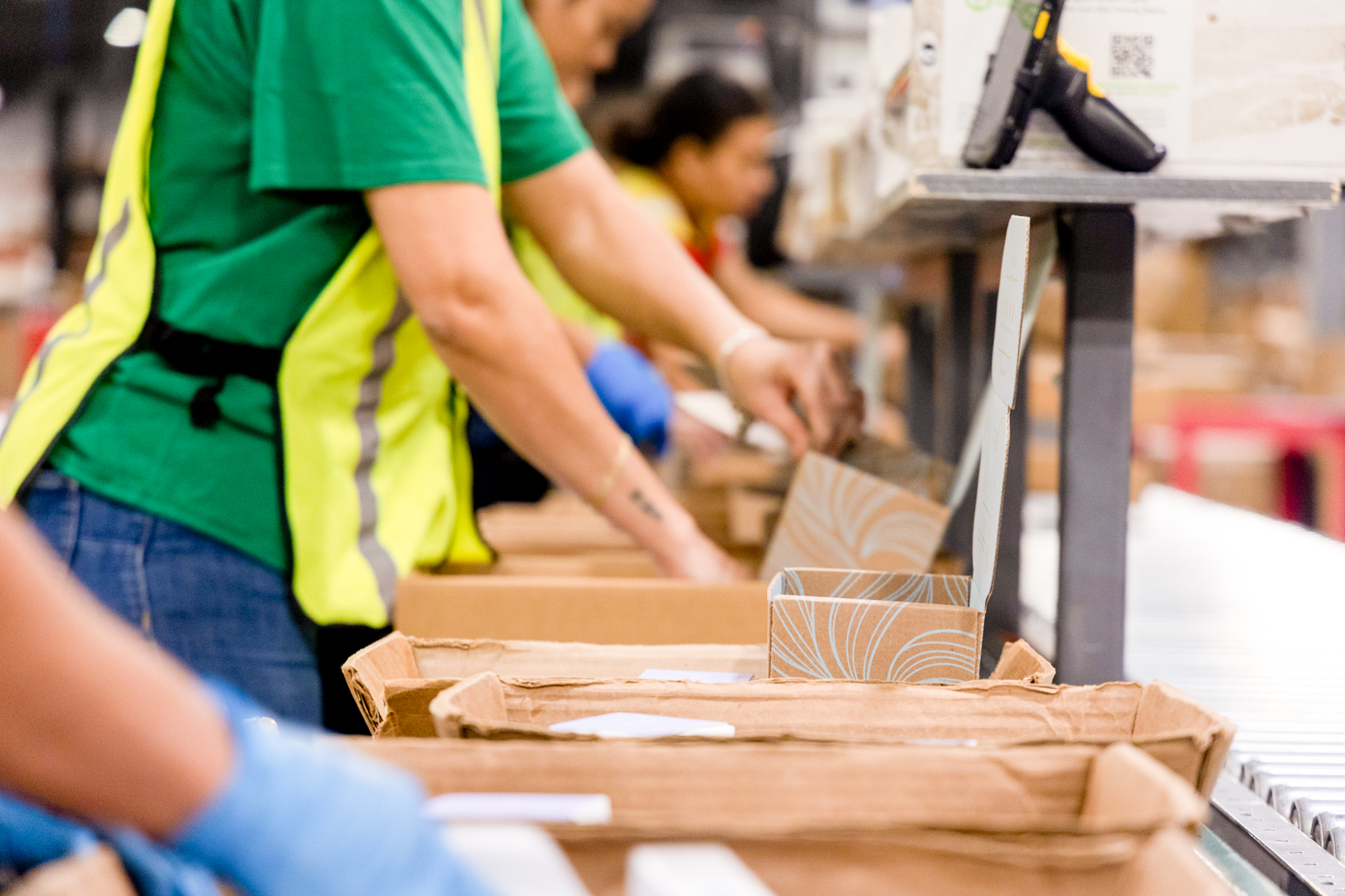 worker checking order accuracy in fulfillment center